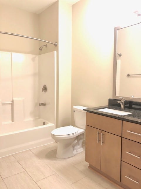 Large Soaking Tub In Master Bathroom With A Tile Surround at Station 40, Nashville, 37209