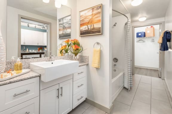 White bathroom with vanity at Solara Apartments, Sanford