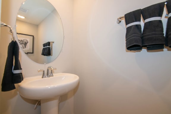 a bathroom with a sink and a mirror at Jackson Run Townhomes, Whitestown, IN 46075