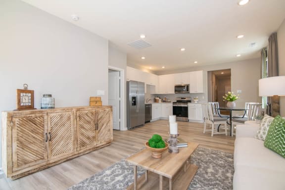 a living room with a couch and a table at Jackson Run Townhomes, Indiana