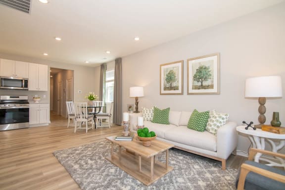 a living room with a couch and a table at Jackson Run Townhomes, Whitestown, IN
