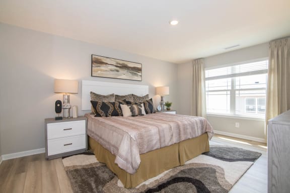 a bedroom with a bed and a window at Jackson Run Townhomes, Whitestown, IN