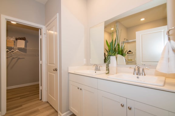 a bathroom with a sink and a mirror at Jackson Run Townhomes, Whitestown, IN 46075