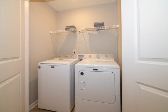 a laundry room with two washes and a dryer in it at Jackson Run Townhomes, Whitestown, 46075
