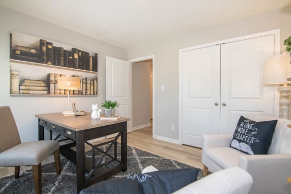 a living room with a desk and a couch at Jackson Run Townhomes, Indiana, 46075