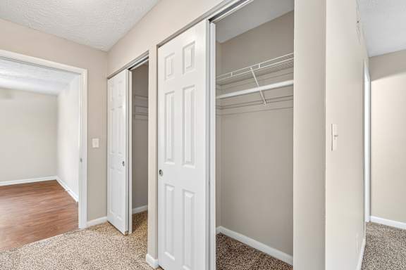 A white closet door is open.