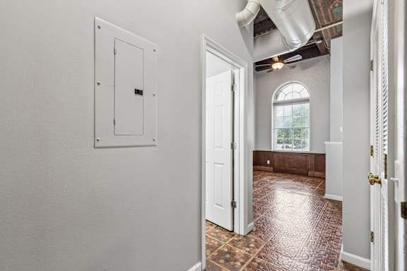 A room with a white door and a window.