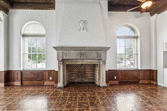 A fireplace in a room with a tiled floor.