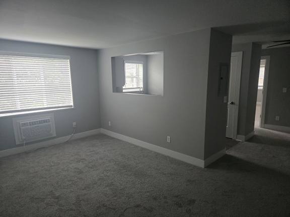 A room with a window and a door.