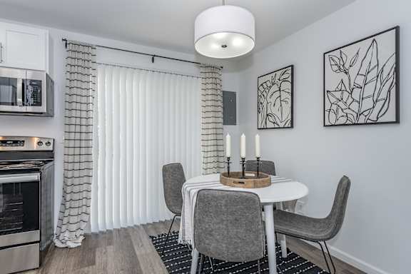 A modern kitchen with a dining table at Ten31, Dayton, Ohio