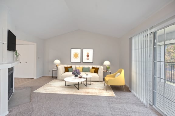 a living room with a white couch and a yellow chair