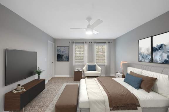 a master bedroom with a large bed and a ceiling fan at Indian Creek Apartments*, Cincinnati, OH, 45236