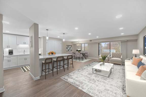 a living room with a kitchen and a dining room at Indian Creek Apartments*, Cincinnati, OH