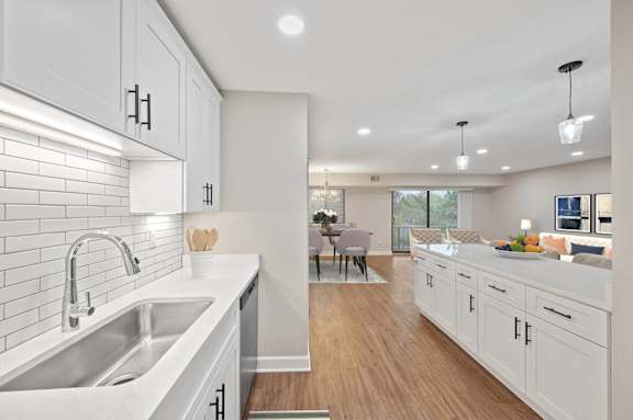 an open kitchen and living room with a large sink and white cabinets at Indian Creek Apartments*, Ohio