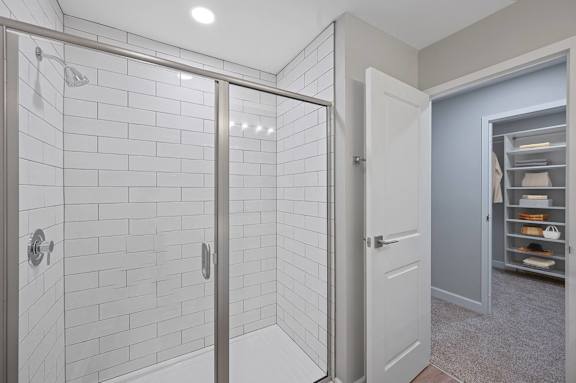 a white bathroom with a shower and a closet at Indian Creek Apartments*, Cincinnati