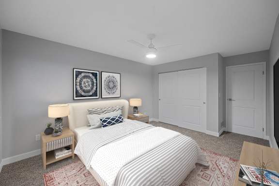 a bedroom with a large bed and a ceiling fan at Indian Creek Apartments*, Cincinnati, Ohio