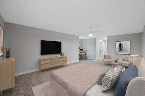 a bedroom with a large bed and a television on the wall at Indian Creek Apartments*, Cincinnati, Ohio