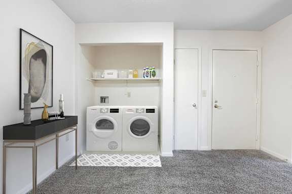 A laundry room with a washer and dryer.