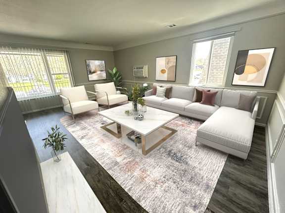 A living room with a white couch, a coffee table, and a rug.