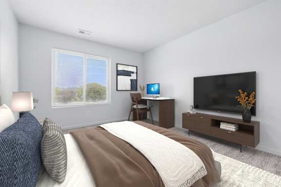 A bedroom with a bed, a television, and a window with blinds.