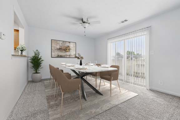 A dining room with a table set for four.