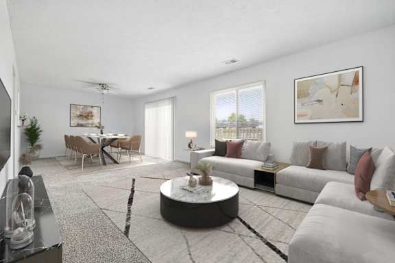 A modern living room with a grey sofa set and a coffee table in the center.
