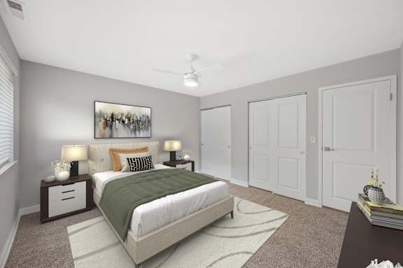 A bedroom with a bed, nightstands, and a painting on the wall. at Indian Creek Apartments*, Ohio, 45236