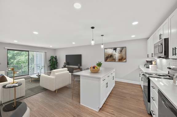 A modern kitchen with a dining area and a living room. at Indian Creek Apartments*, Cincinnati