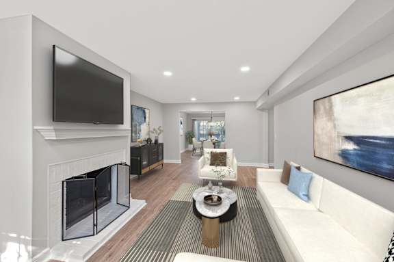 A modern living room with a fireplace and a flat screen TV. A modern living room with a fireplace and a flat screen TV. at Indian Creek Apartments*, Ohio