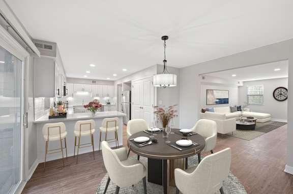 A modern dining room with a round table and chairs. A modern dining room with a round table and chairs. at Indian Creek Apartments*, Cincinnati, OH, 45236