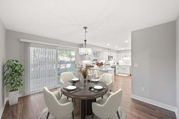 A dining room with a table set for four. A dining room with a table set for four. at Indian Creek Apartments*, Cincinnati, Ohio