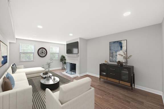 A living room with a fireplace and a TV mounted on the wall. A living room with a fireplace and a TV mounted on the wall. at Indian Creek Apartments*, Cincinnati, OH, 45236