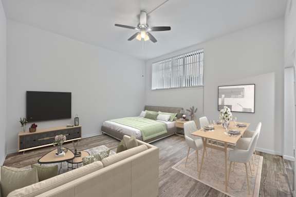 A modern living room with a television, a bed, and a dining table.