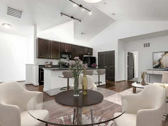 A modern kitchen with a glass table and white chairs. at River View at Bexley Apartments, River View at Bexley, OH, 43209