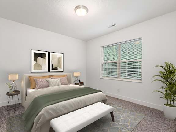 A bedroom with a bed, a bench, and a potted plant. at River View at Bexley Apartments, River View at Bexley, OH