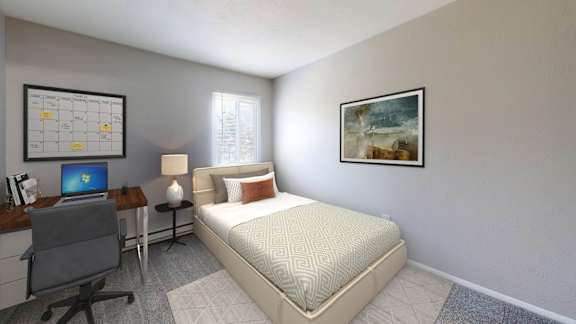 A bedroom with a bed, desk, and chair.