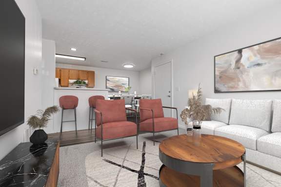 A living room with a red chair and a white couch.