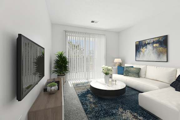 A modern living room with a white couch, a coffee table, and a painting on the wall.