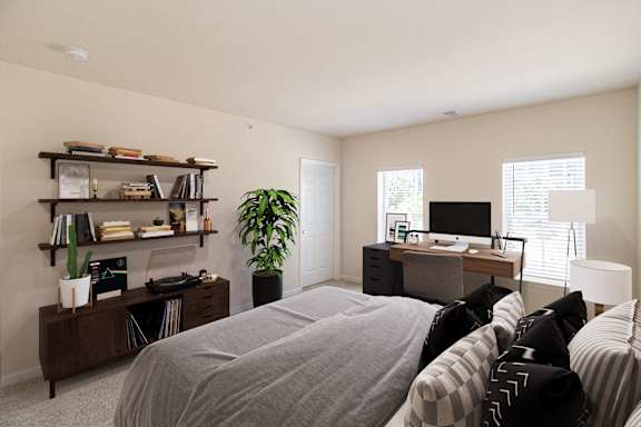 A bedroom with a bed, desk, and shelves. at Roebling Row, Covington, Kentucky