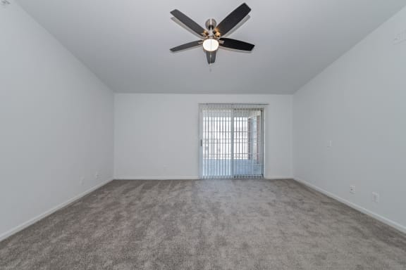 an empty living room with a ceiling fan and a window at Ivy Hills Living Spaces, Cincinnati, Ohio