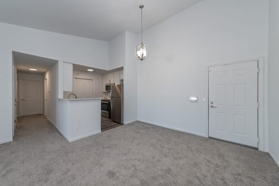 an empty living room and kitchen with a white door at Ivy Hills Living Spaces, Ohio, 45244