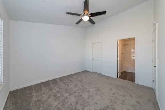 an empty living room with a ceiling fan and white walls at Ivy Hills Living Spaces, Cincinnati, OH