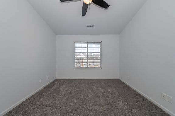 an empty room with carpet and a ceiling fan at Ivy Hills Living Spaces, Cincinnati, 45244
