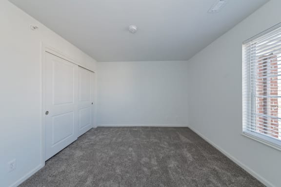 an empty bedroom with white walls and a door and window at Ivy Hills Living Spaces, Ohio, 45244