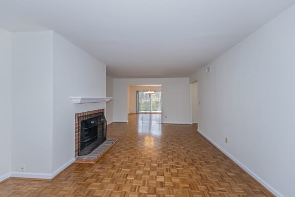 Living room with a fireplace and wooden floors at Indian Creek Apartments*, Ohio, 45236