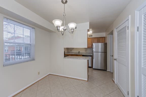 Kitchen with a large window and a door to a refrigerator and a sink at Indian Creek Apartments*, Ohio, 45236