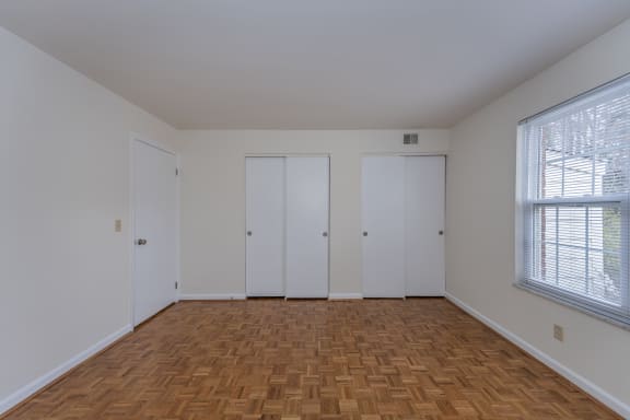 Living room with wood flooring and white walls and doors at Indian Creek Apartments*, Ohio