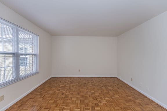 Empty room with wood flooring and a large window at Indian Creek Apartments*, Cincinnati, OH