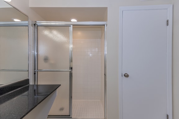 Bathroom with a shower and a sink and a door at Indian Creek Apartments*, Cincinnati, 45236