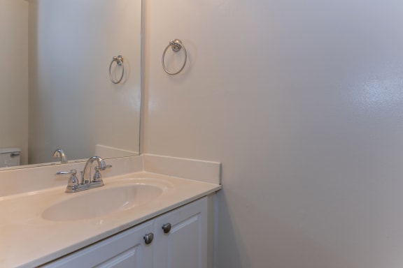 a bathroom with a sink and a mirror at Indian Creek Apartments*, Ohio